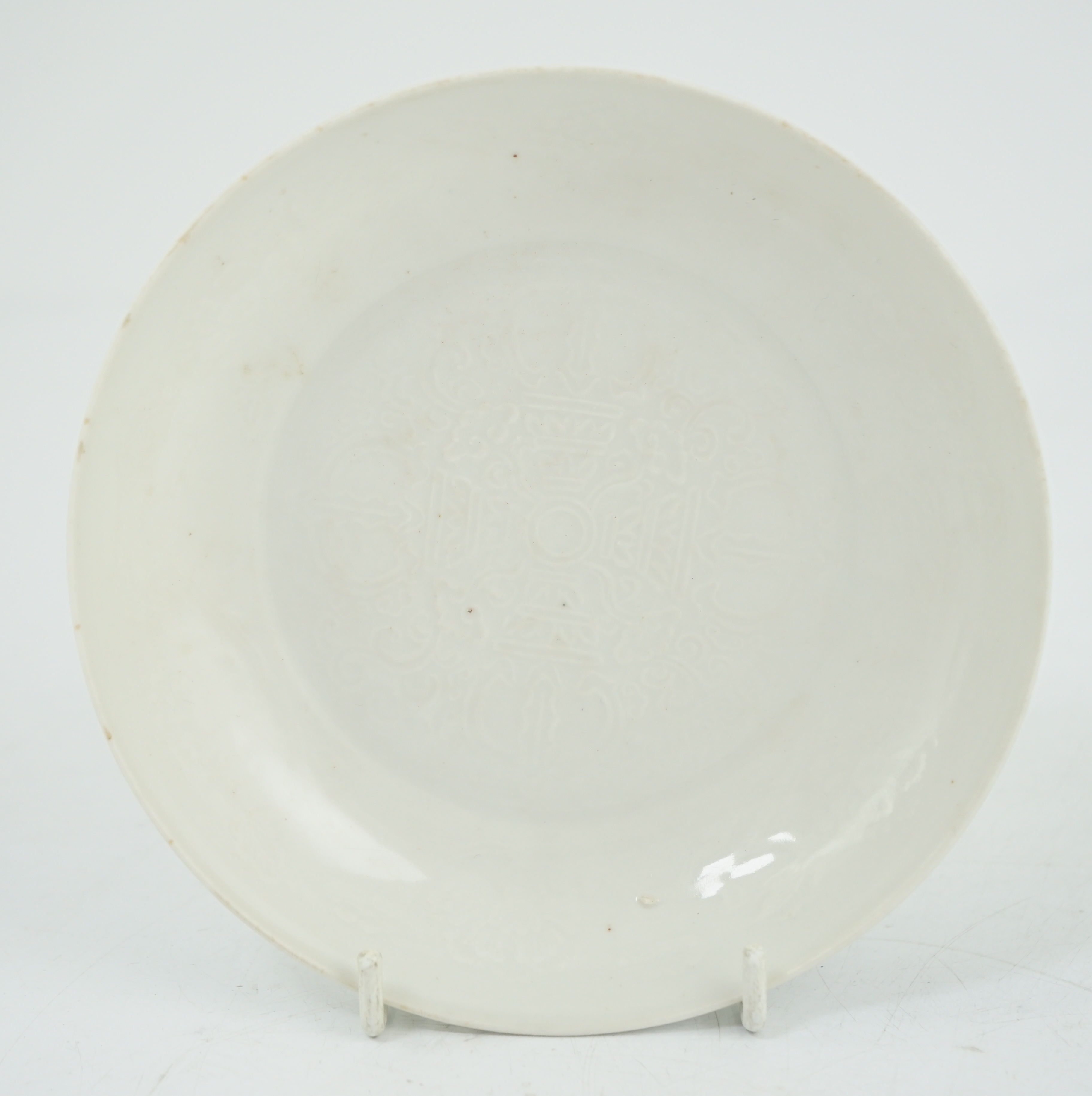 A Chinese moulded white glazed saucer dish, Yongle mark, Republic period